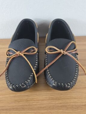Minnetonka Black Slip-On Moccasins with Brown Accent Laces